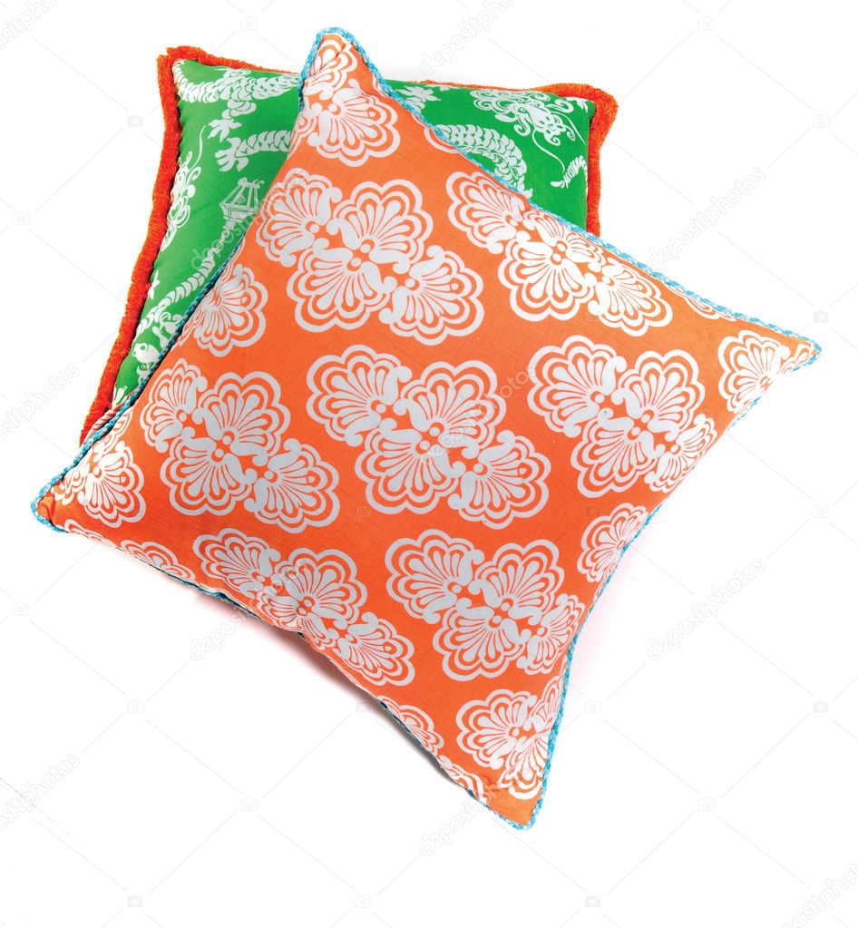 Bright orange and green pillows isolated on white background