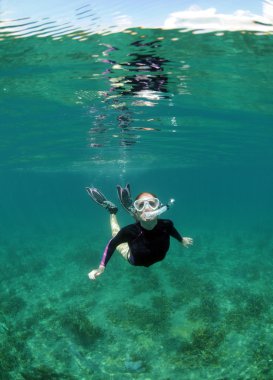 Young woman snorkeling clipart