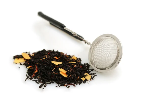 Black tea and infuser on white — Stock Photo, Image