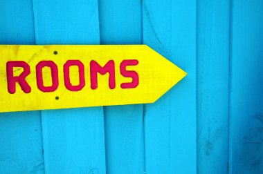 Yellow sign to rooms clipart