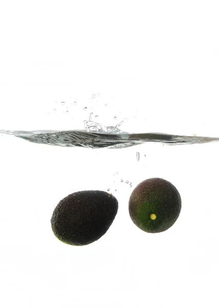 stock image Avocadoes Splashing in water