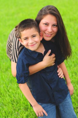 Beautiful mom hugging son clipart