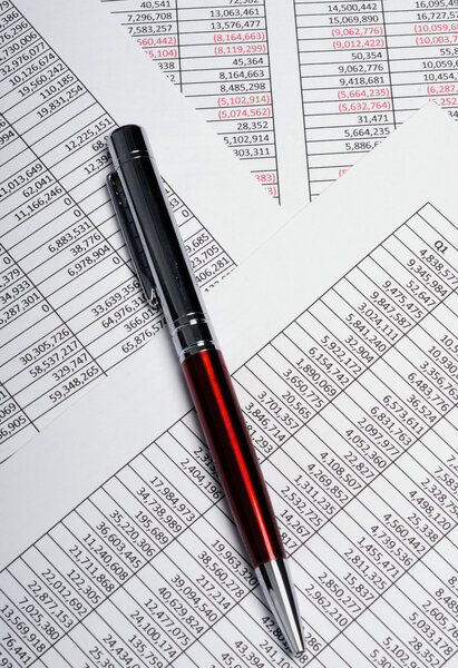 Business spreadsheets with pen
