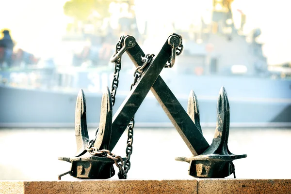 Two anchors on the background of a ship of war — Stock Photo, Image