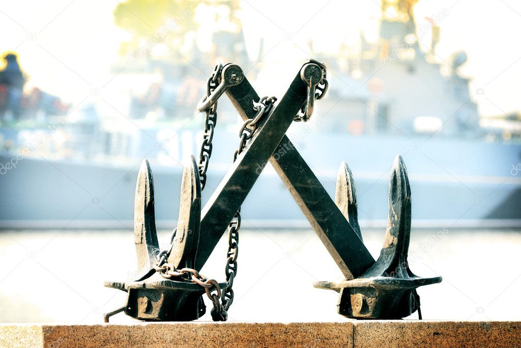 Two anchors on the background of a ship of war