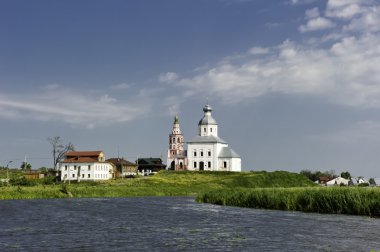 White Russian church near the river. clipart