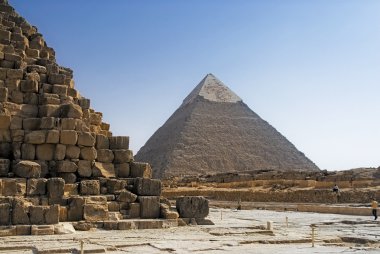 Part of the masonry of the pyramid of Cheops Pyramid of Khafre in the background. clipart