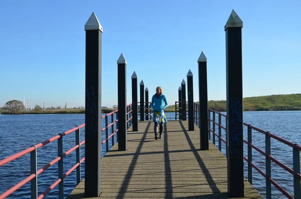 Woman on a landing stage