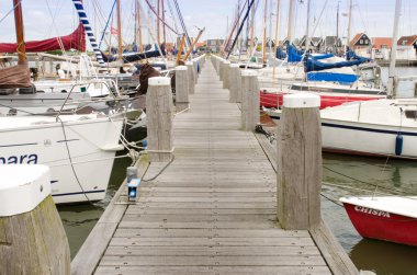 Jetty with sailingboats clipart