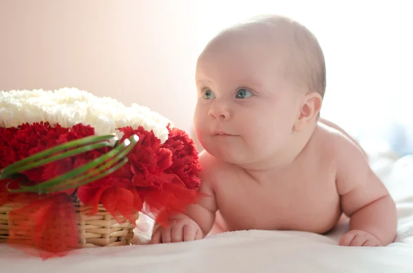 stock image Baby in a bed with flowers