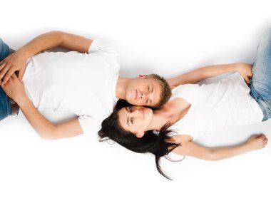 Happy young couple relaxing together clipart