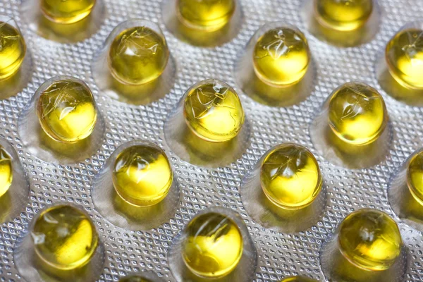 stock image Pack of yellow medical capsules