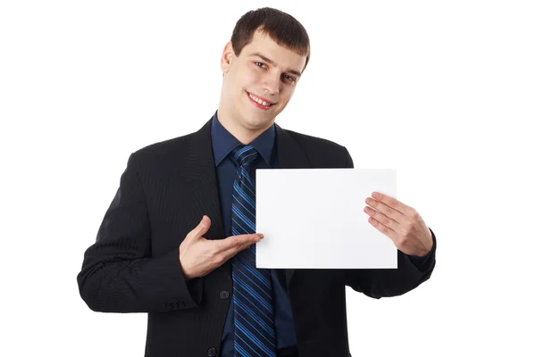 Mladý podnikatel drží prázdné desky, izolovaných na bílém pozadí — Stock fotografie