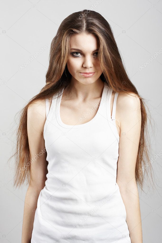 Elegant young woman on light grey background