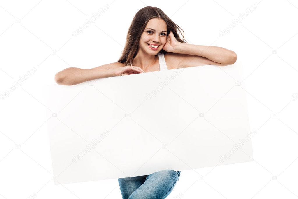 Portrait of a beautiful young woman with blank billboard