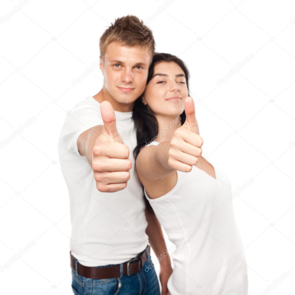 Happy young couple with his thump up. Focus on hands