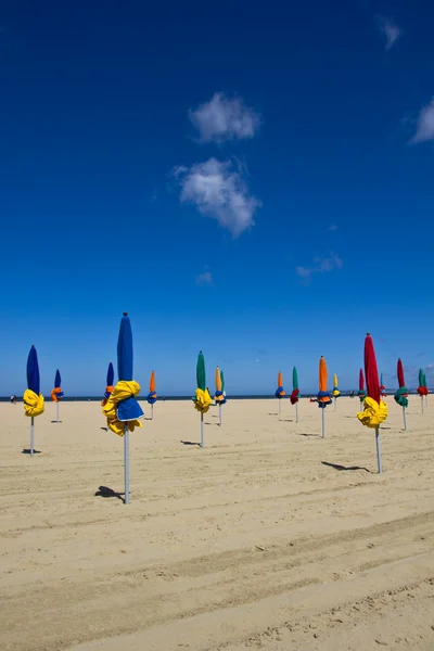 Closed beach umbrellas — Stock Photo, Image
