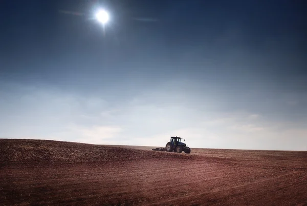 Tractor on the field — Stock Photo, Image