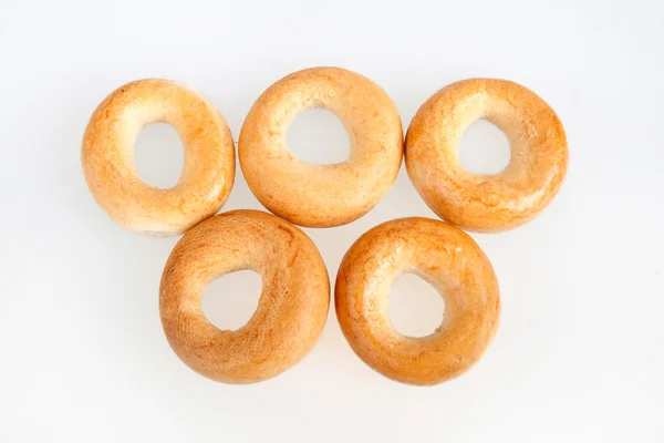 Cinco bagels isolados em branco Fotografia De Stock