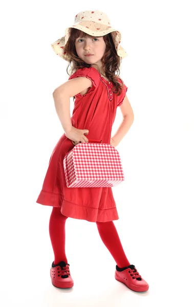 Młoda kobieta moda z czerwonej małej walizki — Zdjęcie stockowe