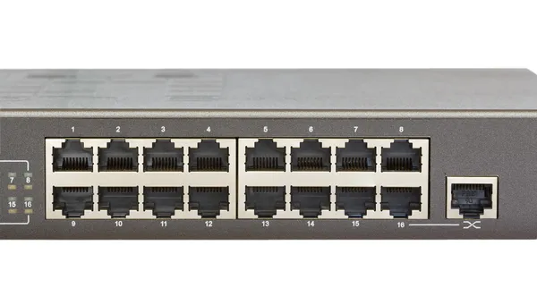 Sieć przełącznik panel przedni z 16 portów i portu uplink na białym tle — Zdjęcie stockowe