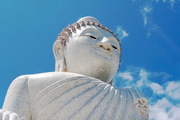 Buddha sculpture over the blue sky background — Stock Photo, Image