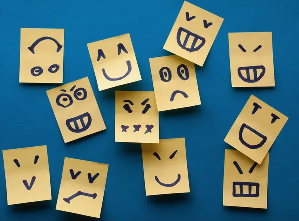 Smilies yellow stickers on blue background — Stock Photo, Image