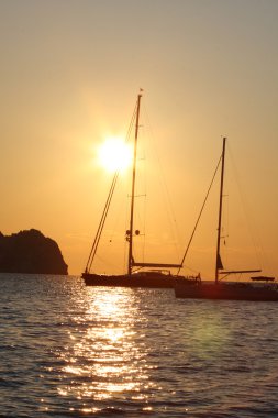 Sailboat in amazing sunset clipart