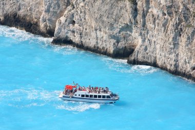 Greek coast with tourist boat clipart