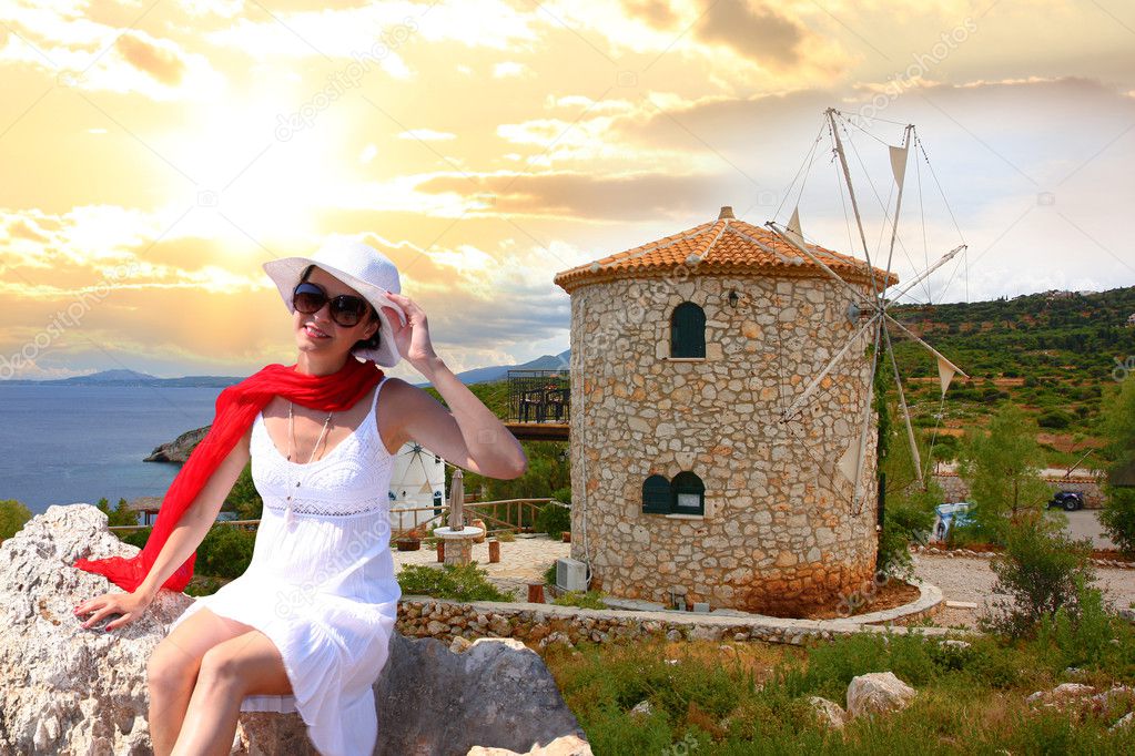 Woman with Greek windmill, Zakynthos Island