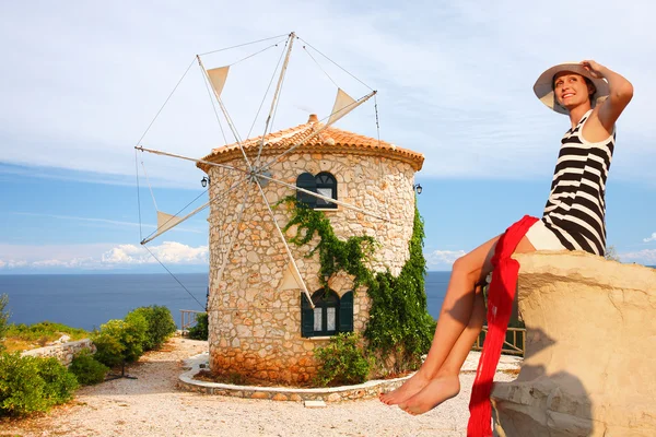 Woman with Greek windmill, Zakynthos Island — Stock Photo, Image