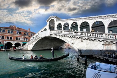 Ponte Rialto bridge with gondola clipart