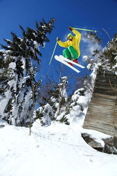 Skier jumping though the air from the cliff — Stock Photo, Image