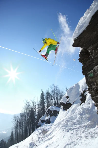 Skier jumping though the air from the cliff — Stock Photo, Image