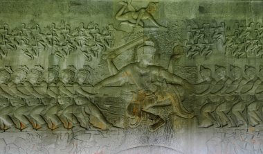 Bas relief 'Churning of the ocean of milk'. Angkor Wat. Cambodia. clipart