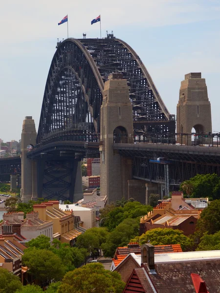 Stock image Rooftops In Front Of The Sydney Harbour Bridge, Sydney, Australia