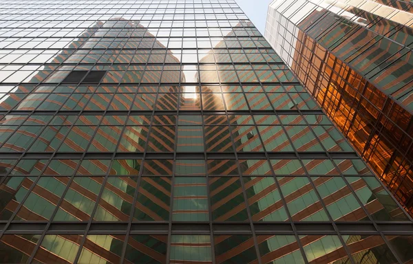 stock image Reflection of a skyscraper on a skyscraper. Kowloon. Hong Kong.