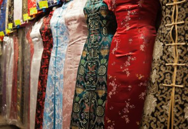 Chinese style dresses. Temple street market. Hong Kong. clipart