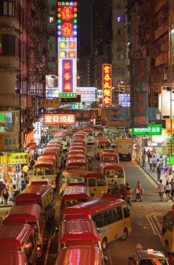 HONG KONG - OCTOBER 01, 2010: National Day of the 's Republic of China on October 01, 2010 in Kowloon, Hong Kong. Busses brought to view celebration fireworks. clipart