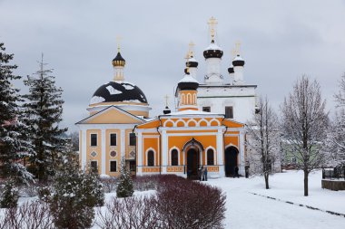 Orthodox monastery Davidova Pustin and Assumption church of the Blessed Virgin Mary in winter. Chekhov. Moscow region. Russia. clipart