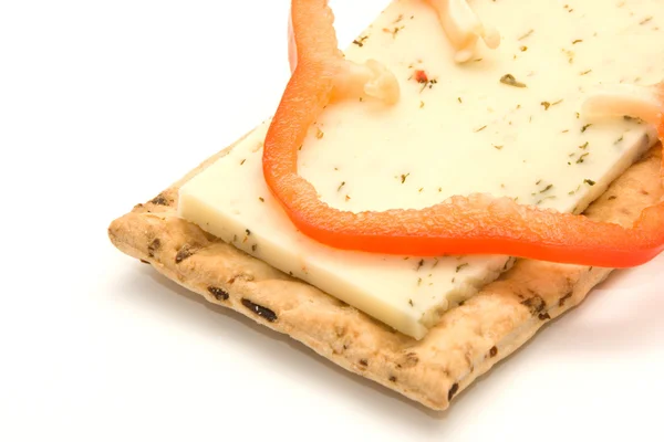 Cracker with cheese and pepper — Stock Photo, Image