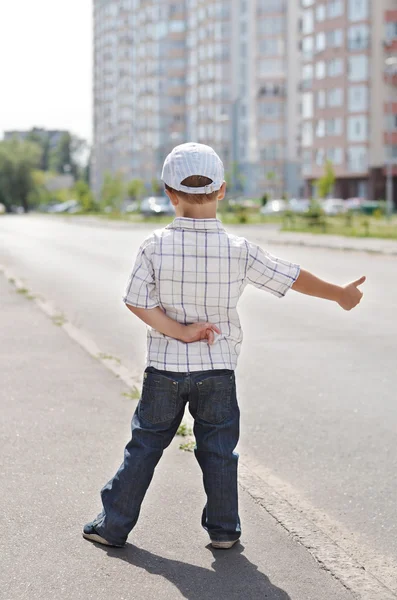 stock image Boy hitching on road