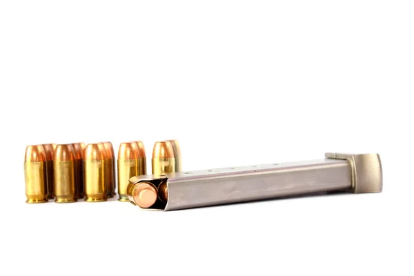 Isolated 380 handgun ammo with clip - Stock Image. 