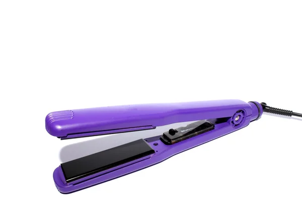 Žehlička na vlasy fialový — Stock fotografie