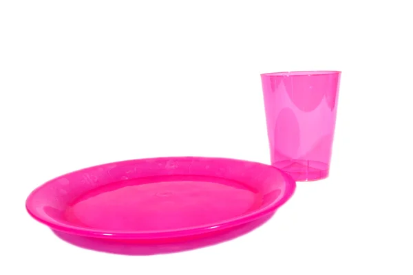 Розовый кубок и тарелка — стоковое фото
