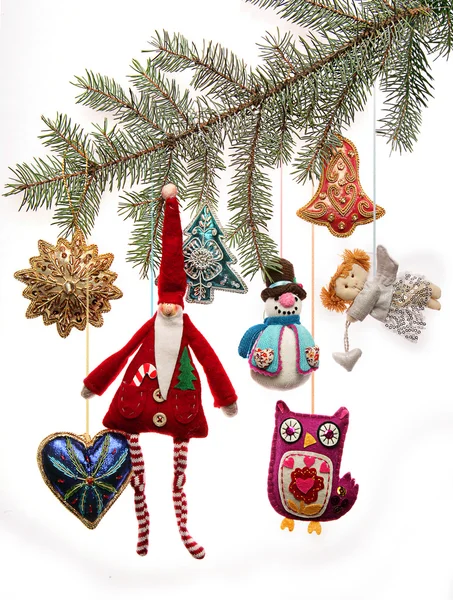 Старовинні різдвяні іграшки на гілці ялинки Стокове Фото