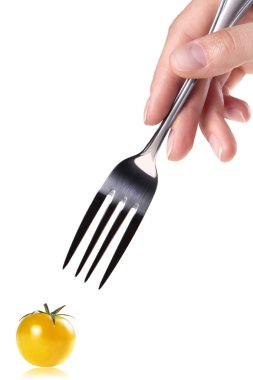 Fork with red and yellow Fresh tomato clipart