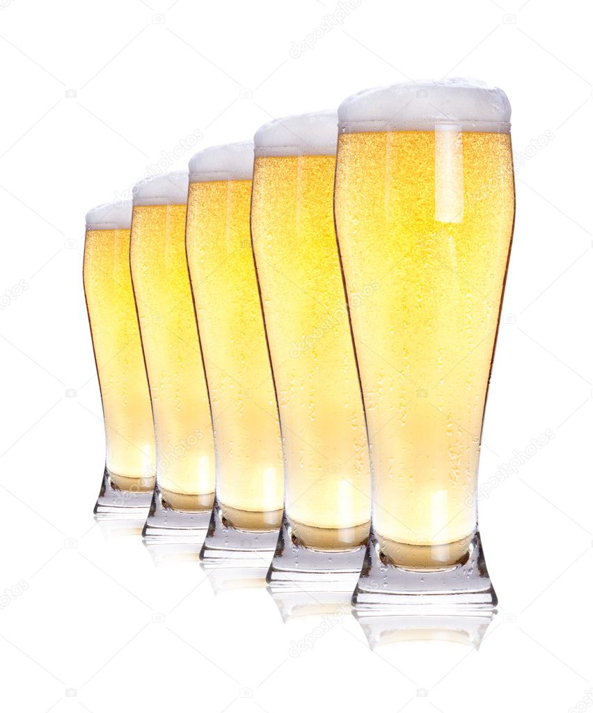 Frosty glass of light beer isolated on a white background.