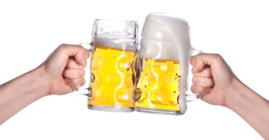 Two hands holding beers making a toast clipart