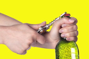 Hand opening beer bottle with metal opener clipart